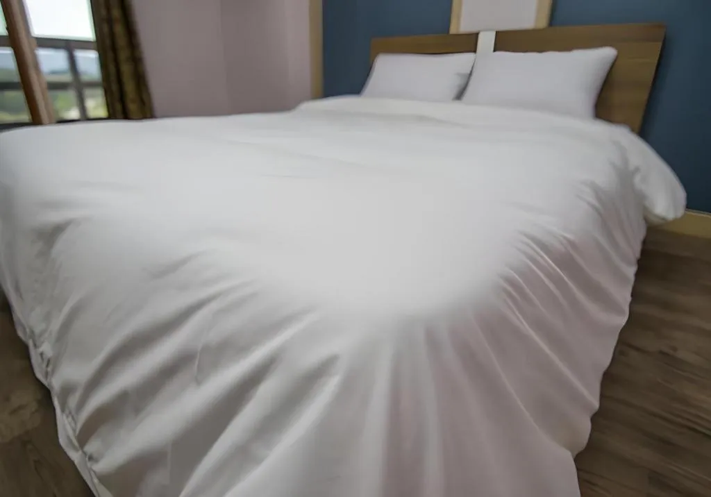 Bed in Hyundai Elliot Hotel and Resort