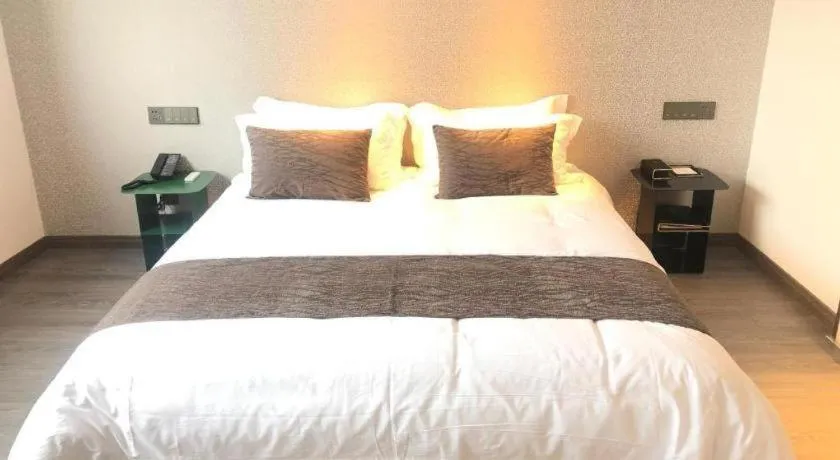 Bed in Taiyi International Hotel