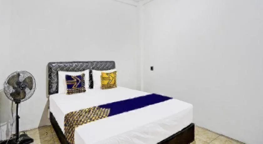 Bed in Hotel O Griya Sandi Residence Family NearPantai Boom