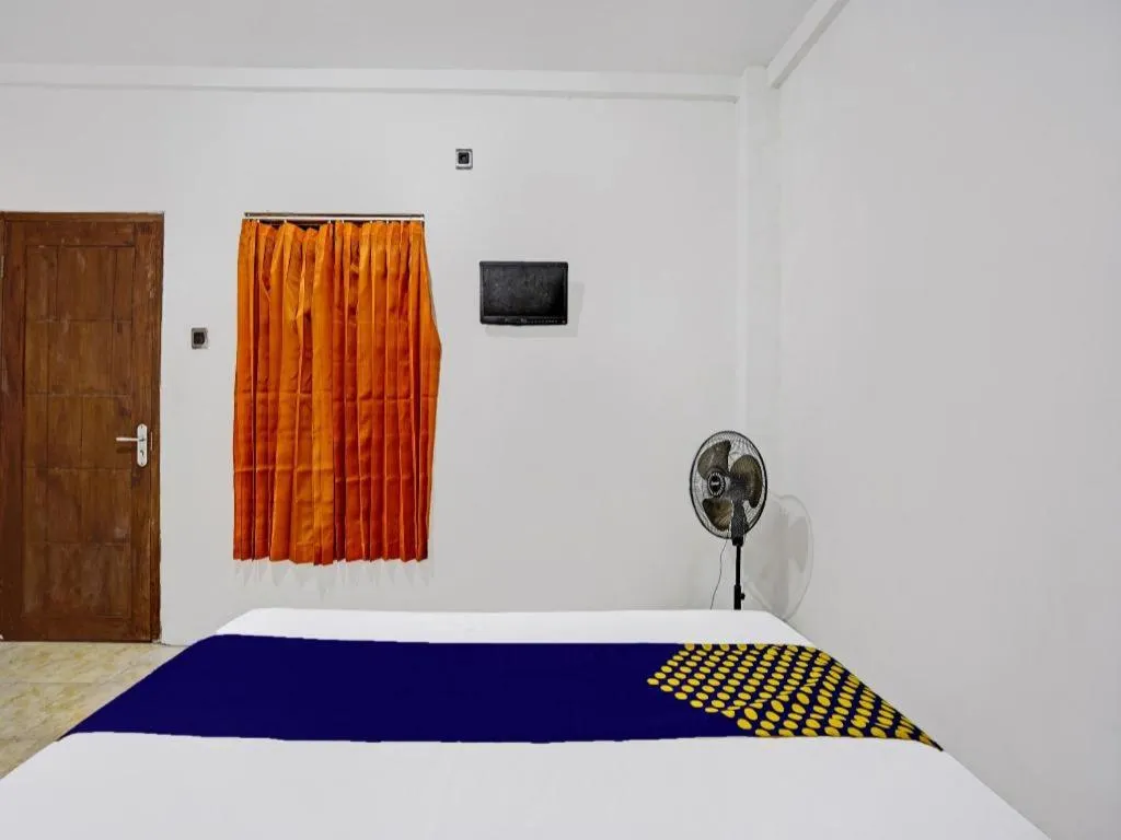 Bed in Hotel O Griya Sandi Residence Family NearPantai Boom