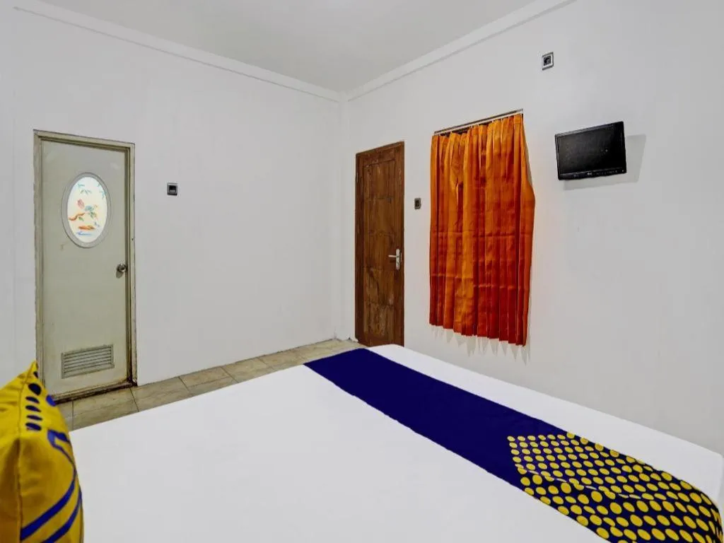 Bed in Hotel O Griya Sandi Residence Family NearPantai Boom