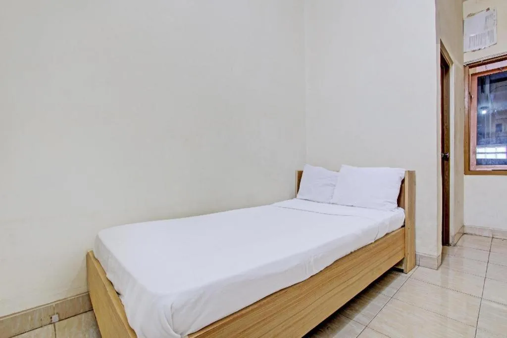 Bed in OYO Life 92663 Karmel 6