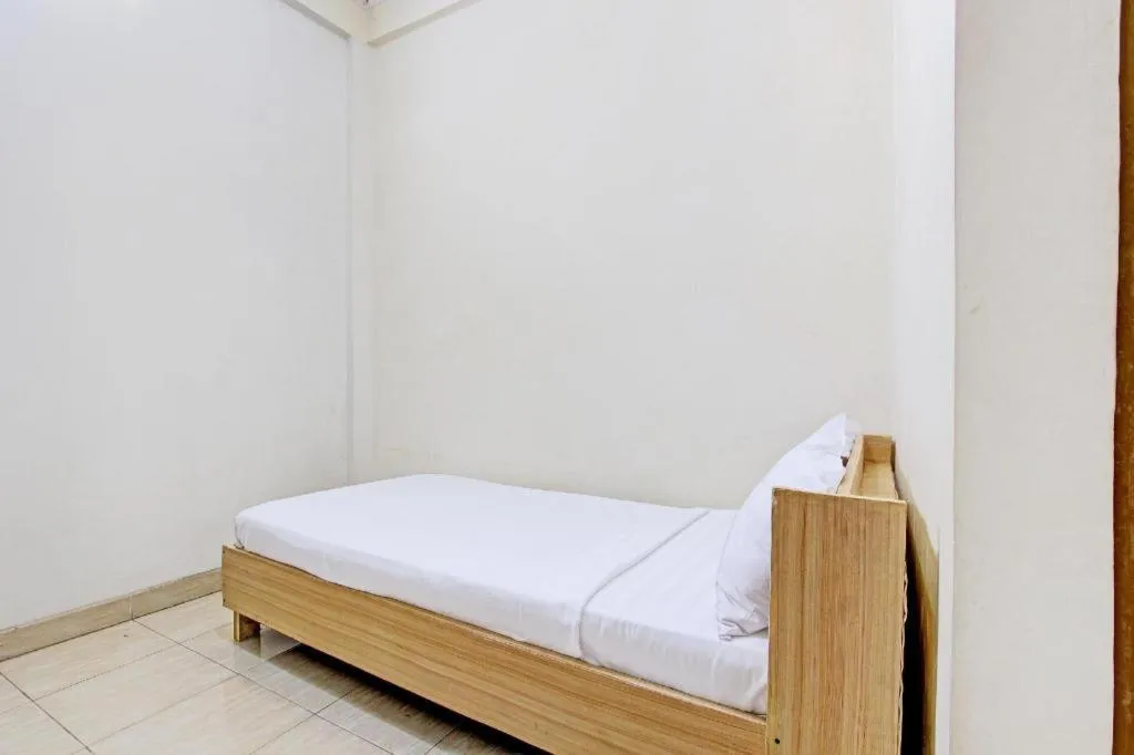 Bed in OYO Life 92663 Karmel 6