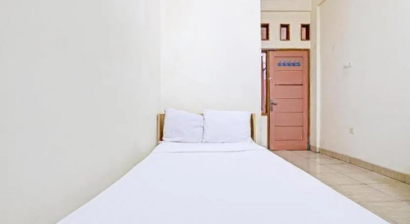 Bed in OYO Life 92663 Karmel 6