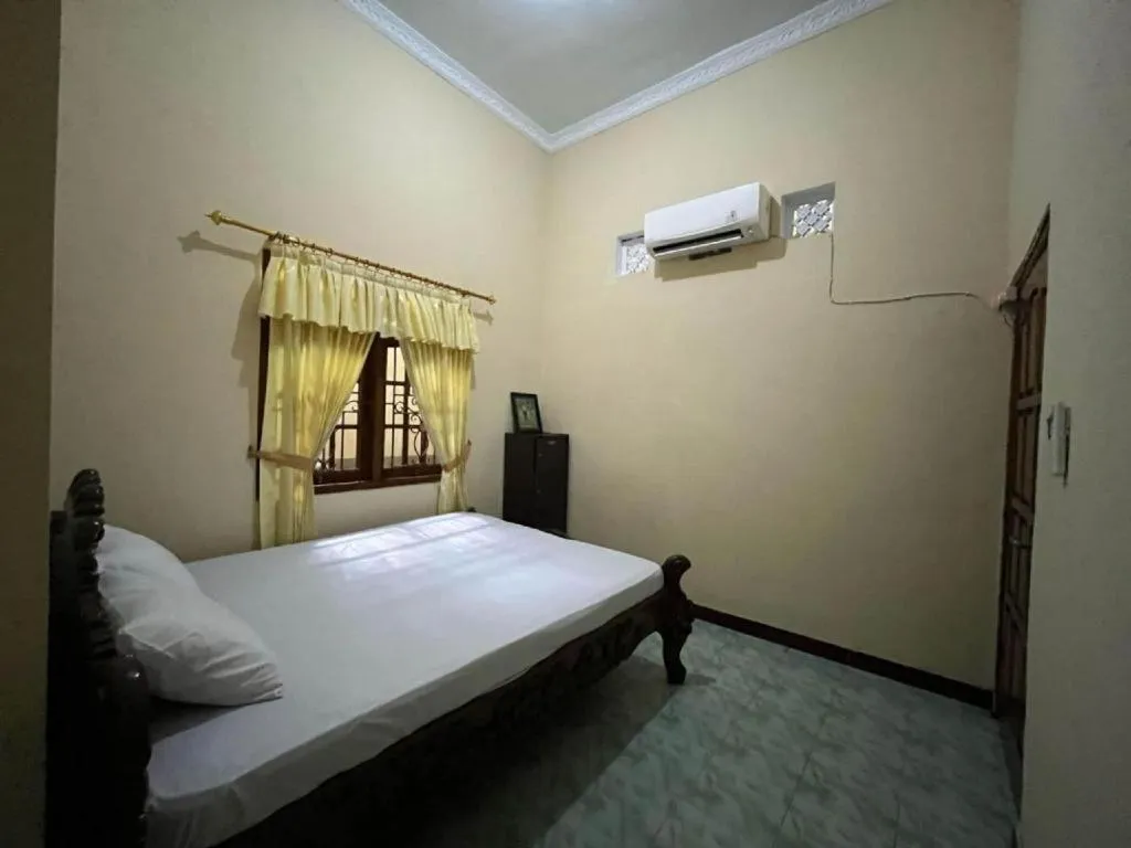 Bed in OYO 94003 Anjuk Ladang Homestay
