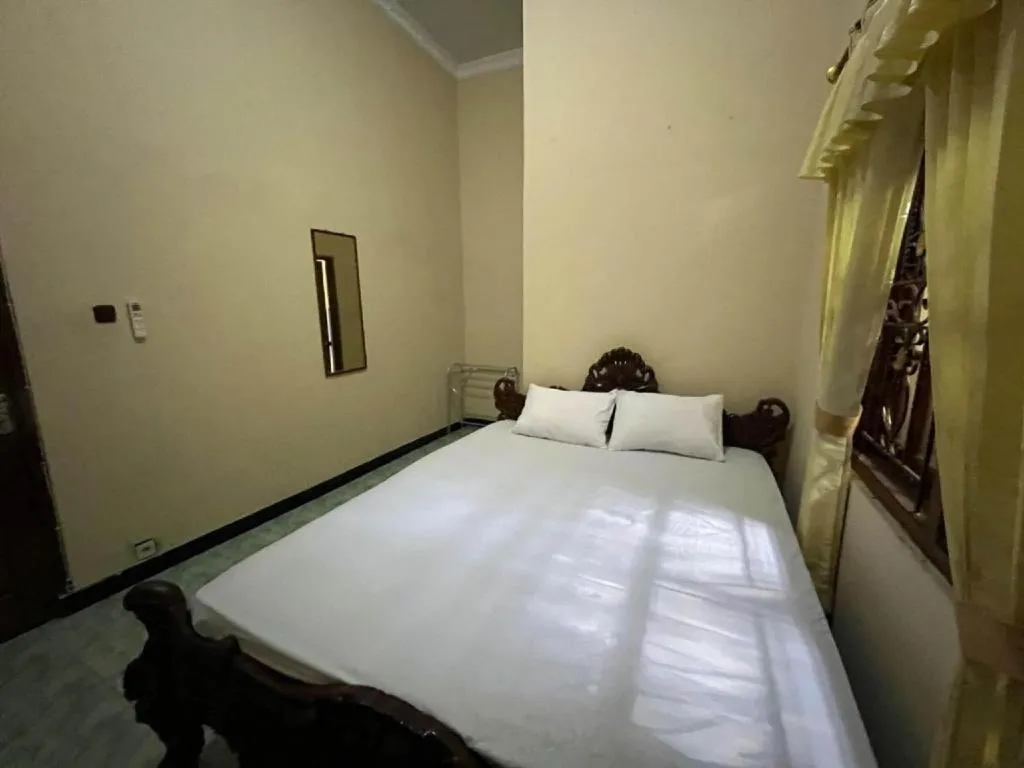 Bed in OYO 94003 Anjuk Ladang Homestay