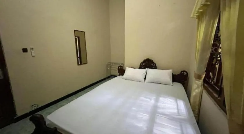 Bed in OYO 94003 Anjuk Ladang Homestay