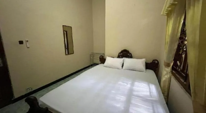 Bed in OYO 94003 Anjuk Ladang Homestay