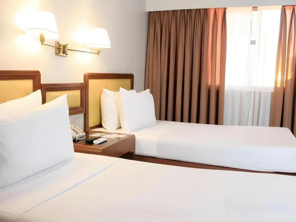 Bed in Palm Hotel Manila