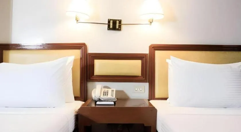 Bed in Palm Hotel Manila