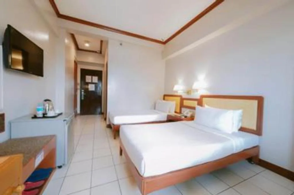 Bed in Palm Hotel Manila