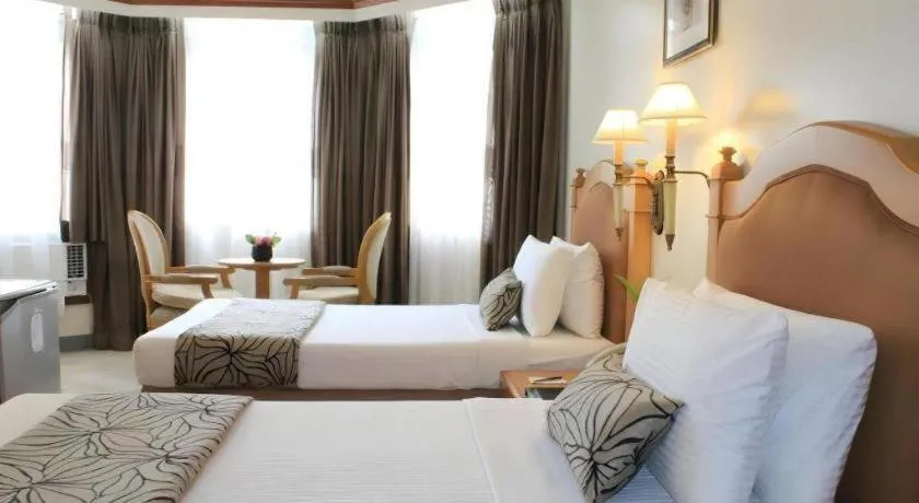 Bed in Palm Hotel Manila