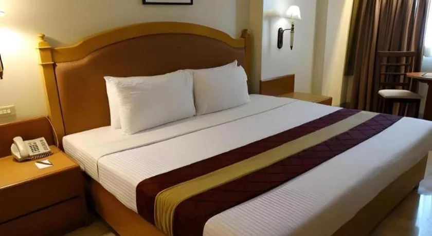 Bed in Palm Hotel Manila