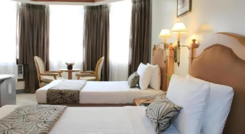 Bed in Palm Hotel Manila