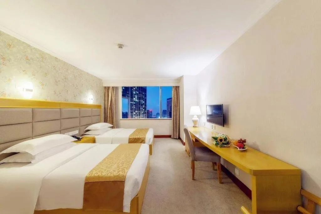 Bed in Xiamen Plaza Hotel