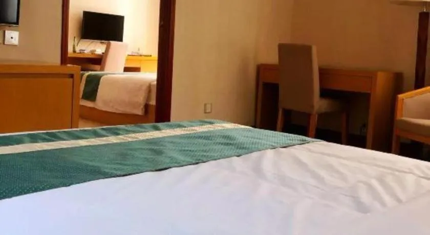 Bed in Xiamen Plaza Hotel