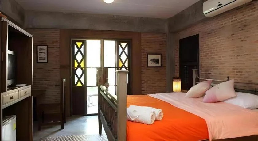 Bed in Baan Gong Kham Hotel