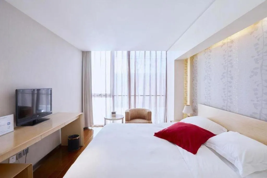 Bed in Hotel Kapok Wangfujing