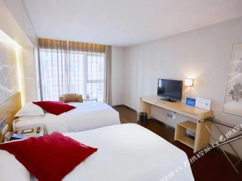 Bed in Hotel Kapok Wangfujing