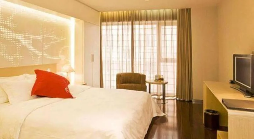 Bed in Hotel Kapok Wangfujing