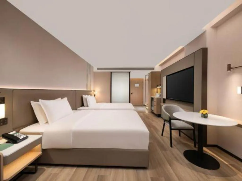 Bed in Yiwu Yimei Plaza Hotel