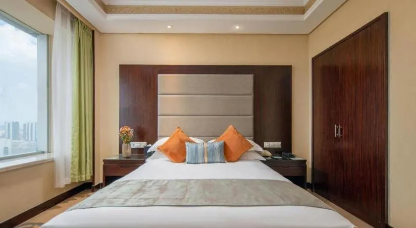 Bed in Yiwu Yimei Plaza Hotel