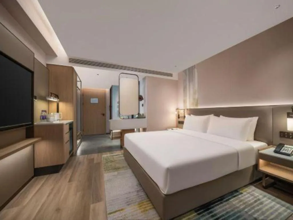 Bed in Yiwu Yimei Plaza Hotel