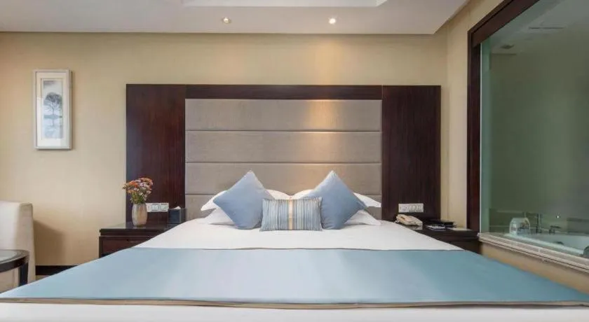 Bed in Yiwu Yimei Plaza Hotel
