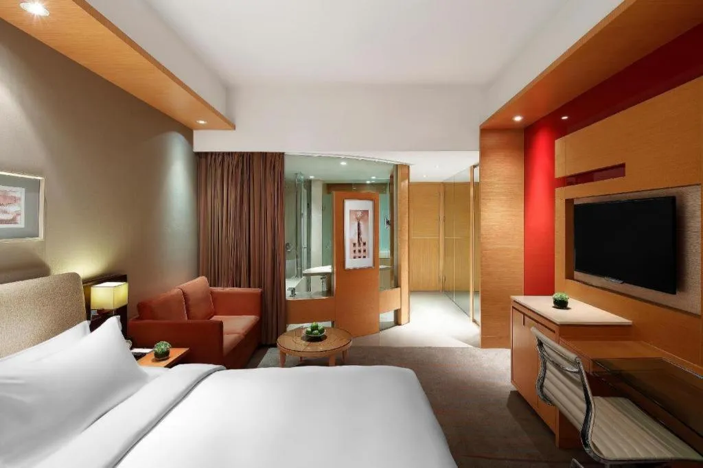 Bed in New World Wuhan Hotel