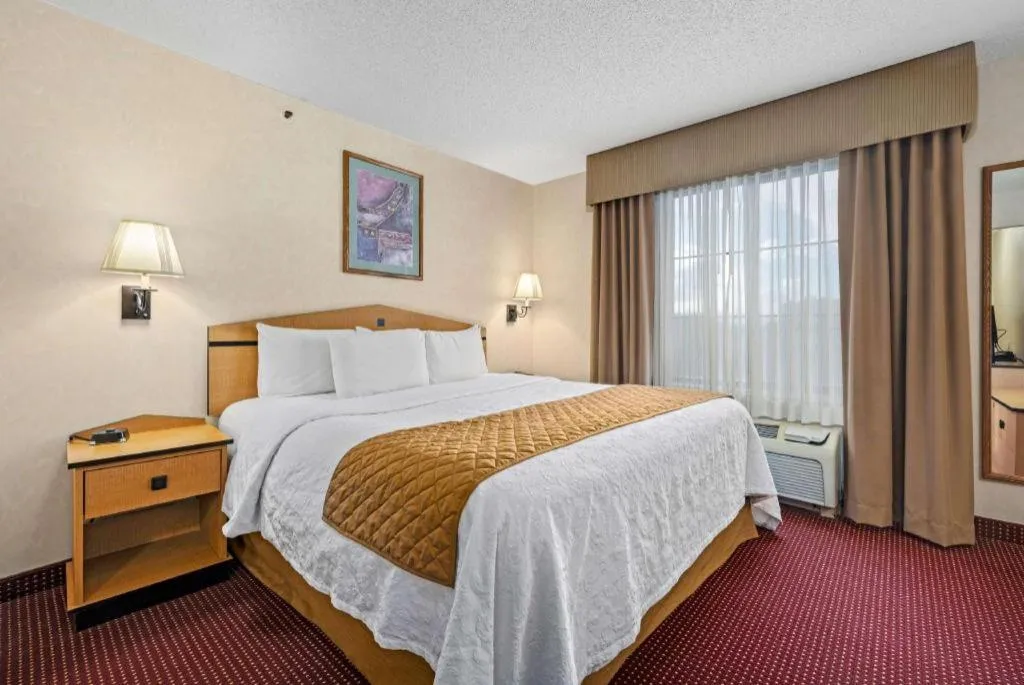 Bed in AmericInn by Wyndham Denver Airport