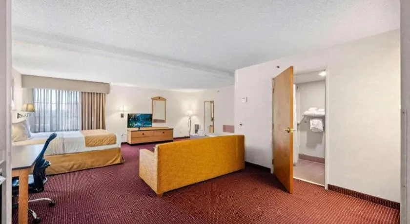 Bed in AmericInn by Wyndham Denver Airport