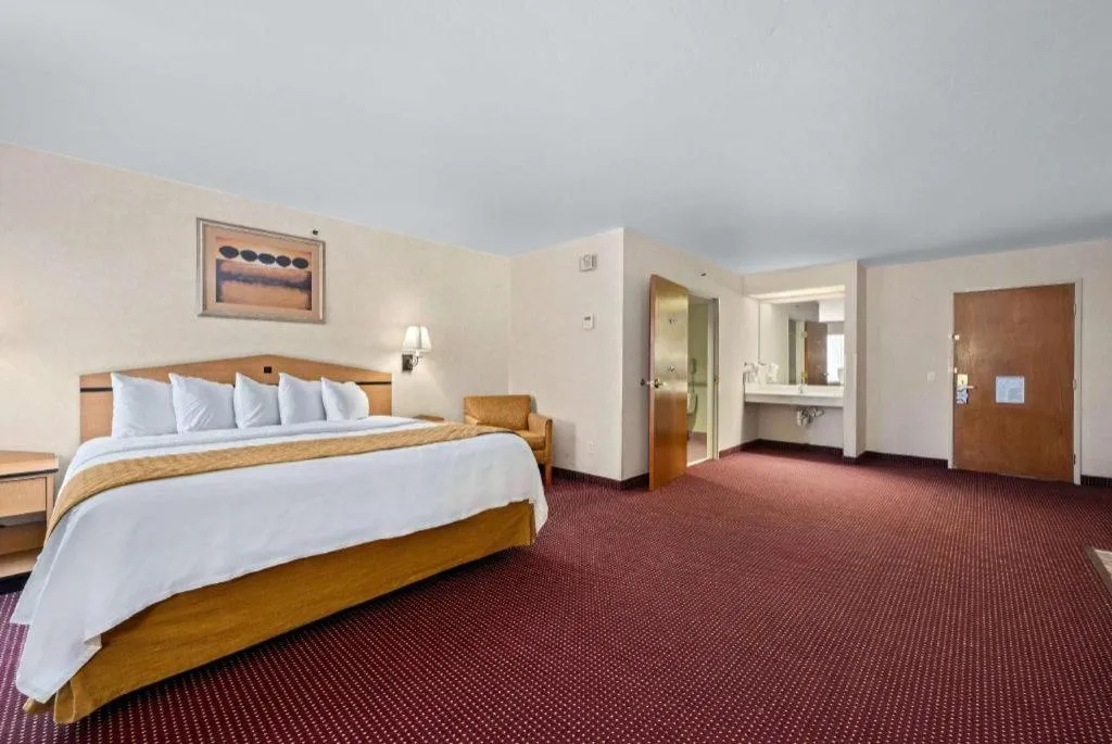 Bed in AmericInn by Wyndham Denver Airport