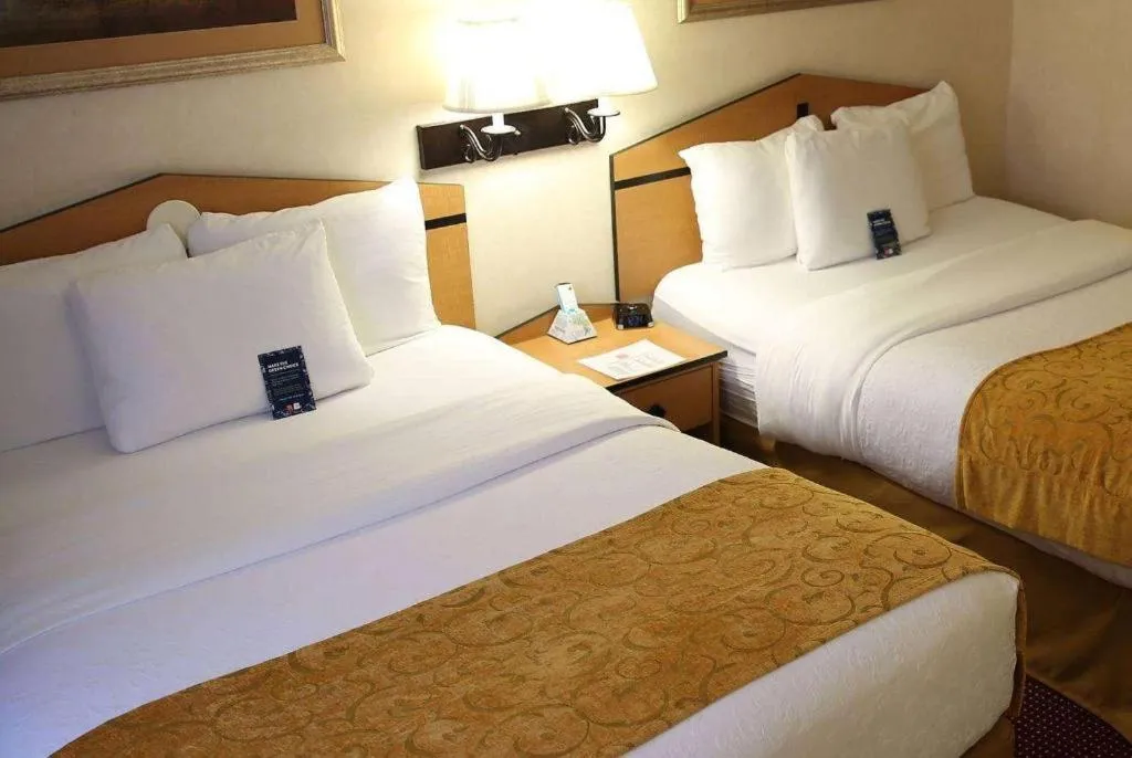 Bed in AmericInn by Wyndham Denver Airport