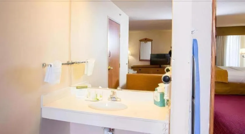 Bed in AmericInn by Wyndham Denver Airport