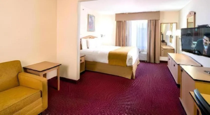 Bed in AmericInn by Wyndham Denver Airport