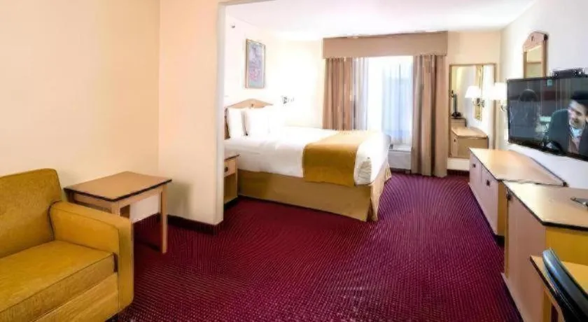 Bed in AmericInn by Wyndham Denver Airport