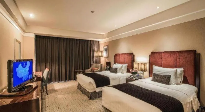 Bed in Grand New Century Hotel Binhai Tianjin