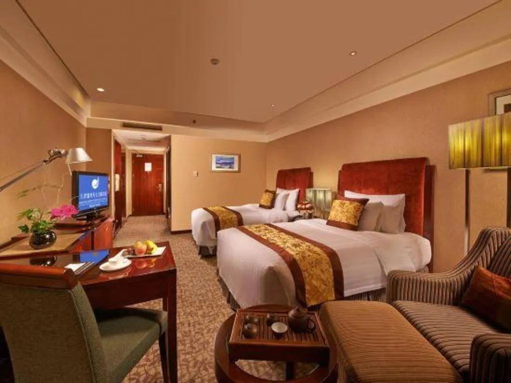 Bed in Grand New Century Hotel Binhai Tianjin