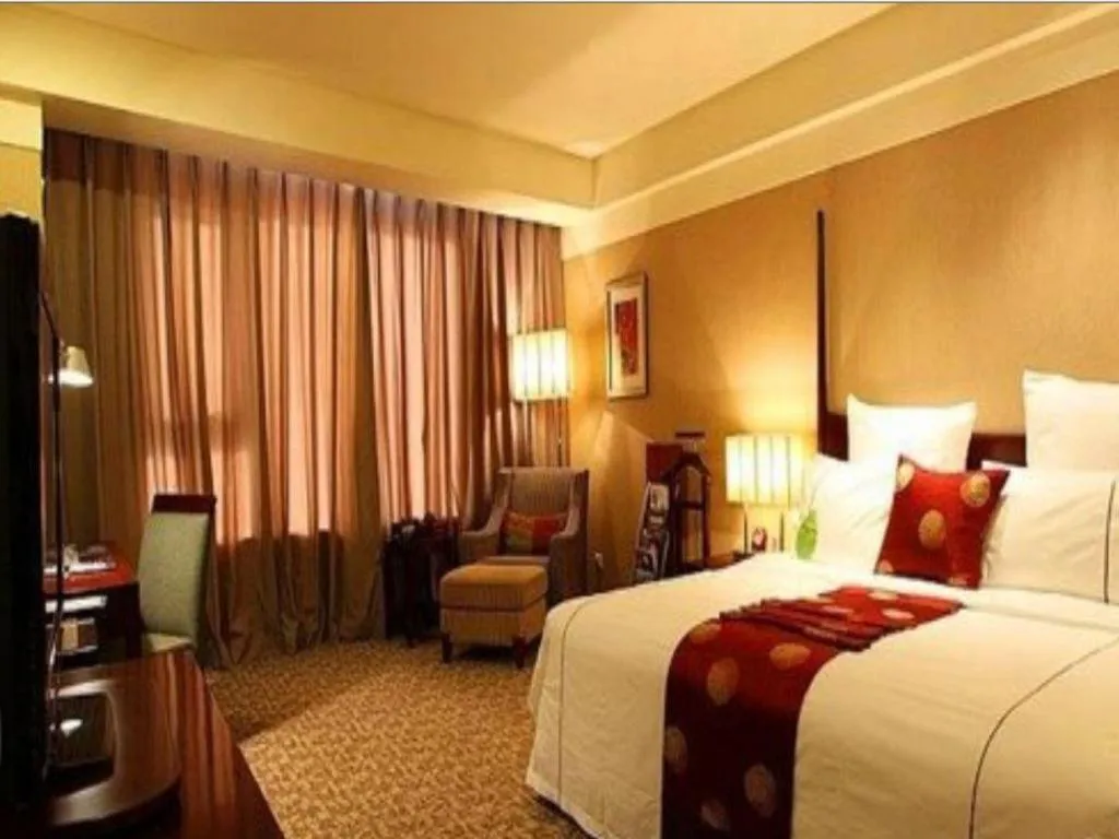 Bed in Grand New Century Hotel Binhai Tianjin