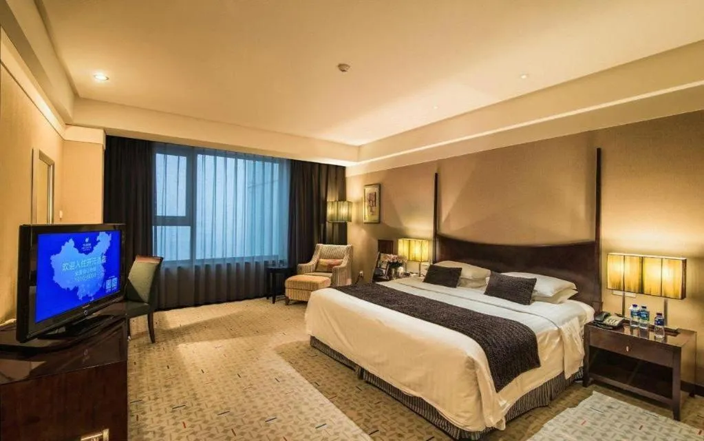 Bed in Grand New Century Hotel Binhai Tianjin