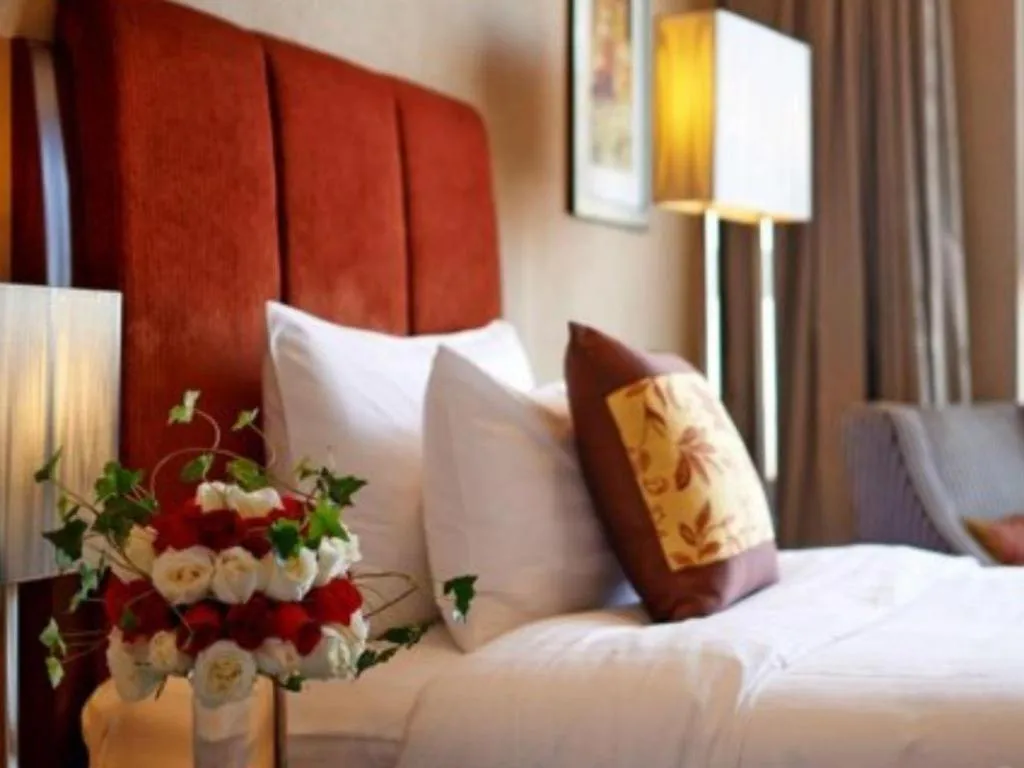 Bed in Grand New Century Hotel Binhai Tianjin