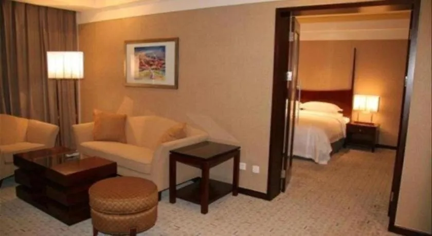 Bed in Grand New Century Hotel Binhai Tianjin