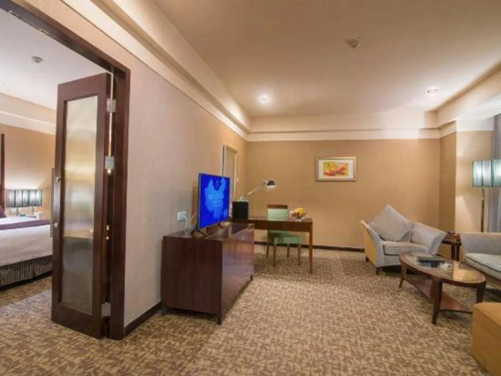 Bed in Grand New Century Hotel Binhai Tianjin