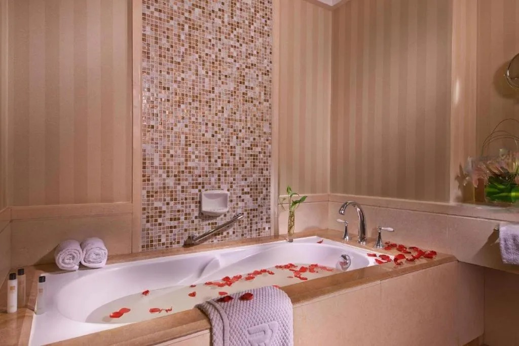 Bed in Grand New Century Hotel Binhai Tianjin