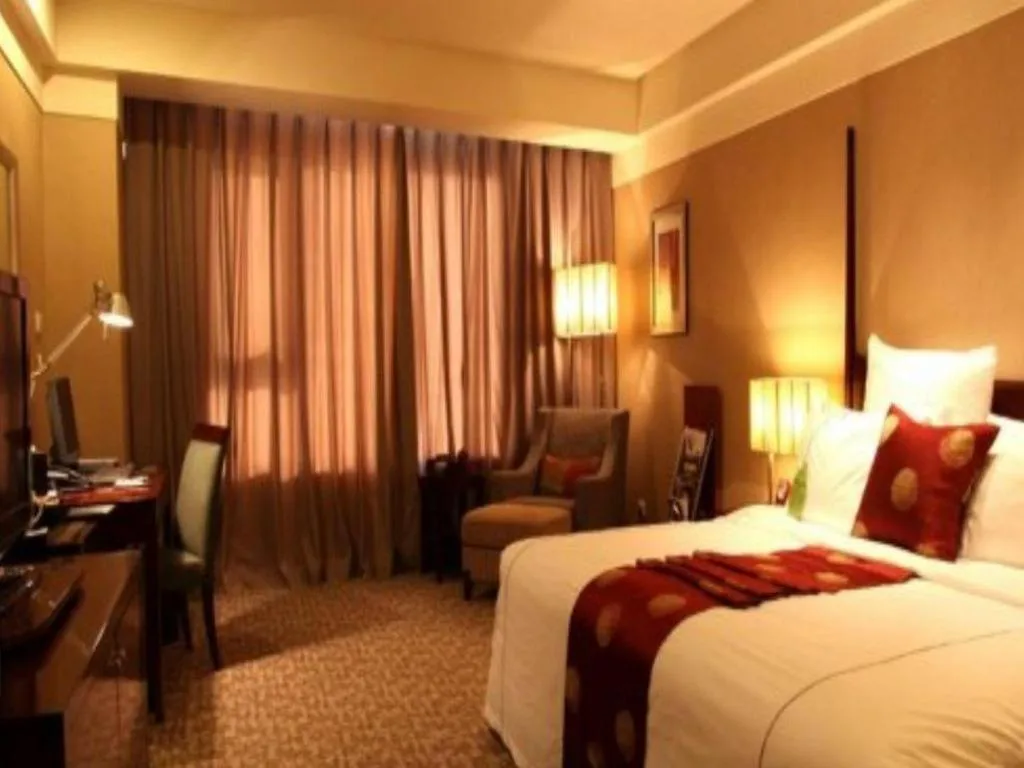 Bed in Grand New Century Hotel Binhai Tianjin