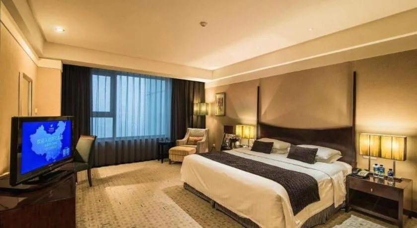 Bed in Grand New Century Hotel Binhai Tianjin