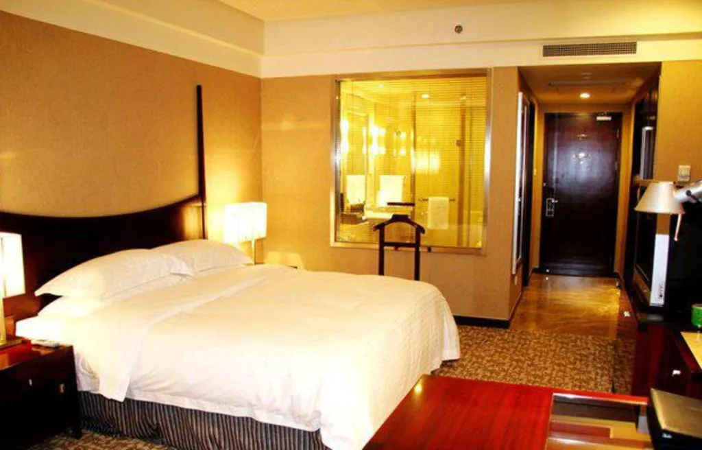 Bed in Grand New Century Hotel Binhai Tianjin