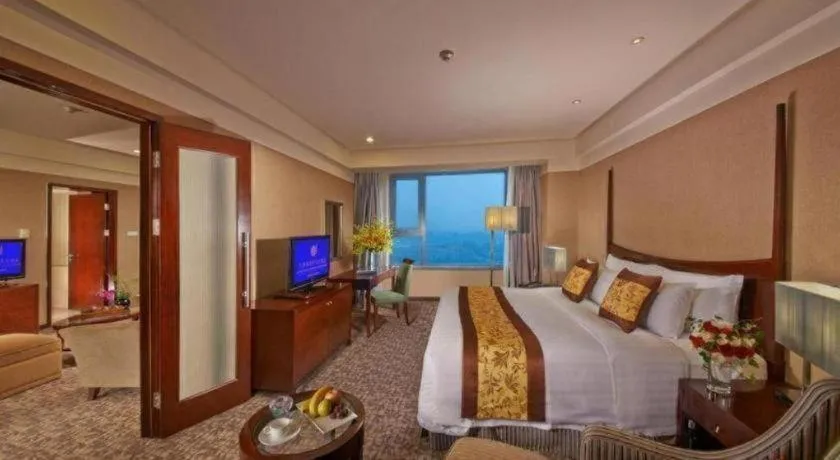 Bed in Grand New Century Hotel Binhai Tianjin