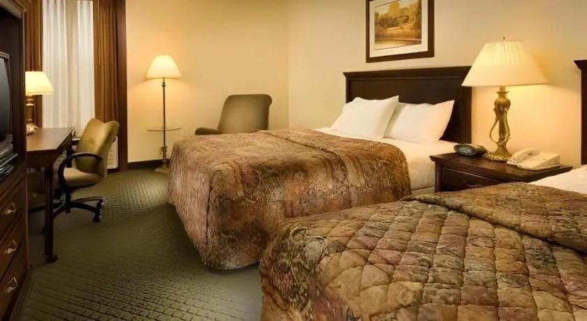 Bed in AmericInn by Wyndham Memphis East
