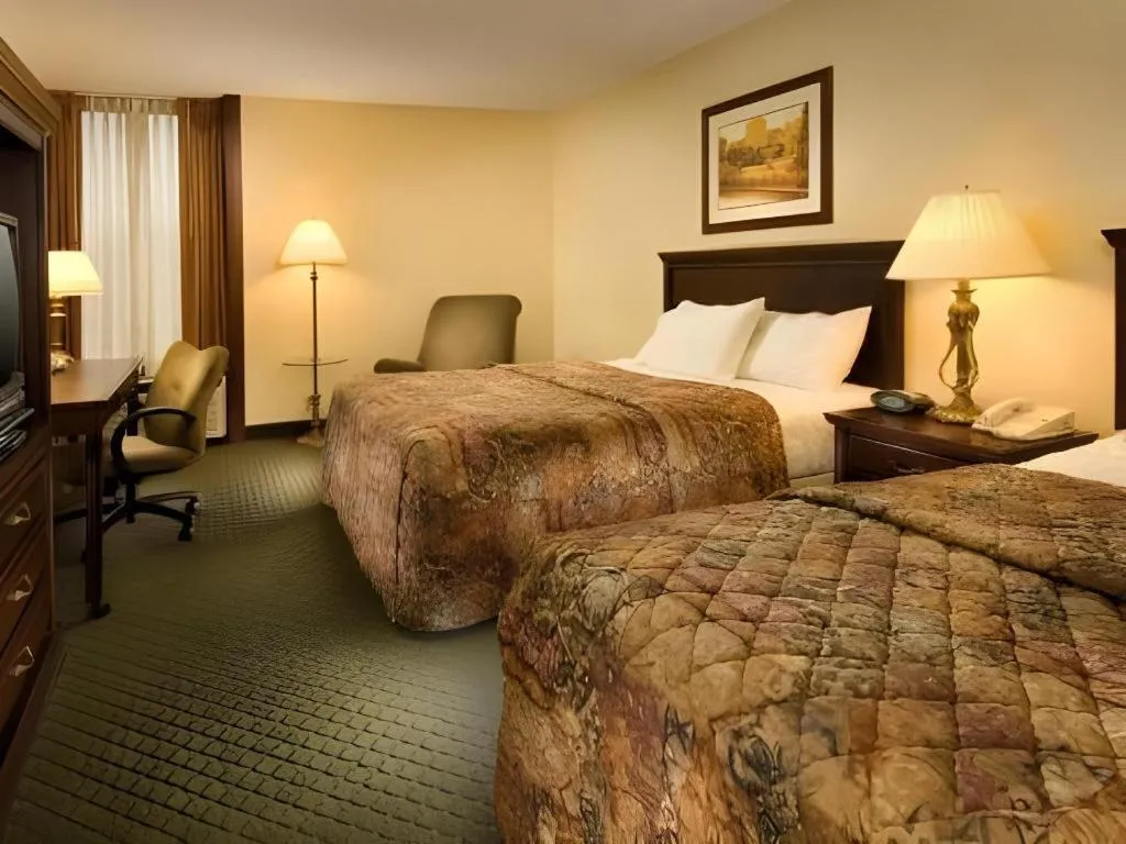 Bed in AmericInn by Wyndham Memphis East